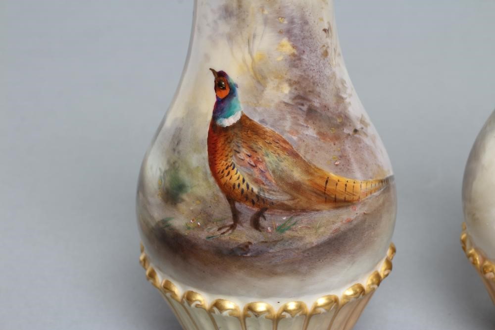 A PAIR OF ROYAL WORCESTER CHINA VASES Image