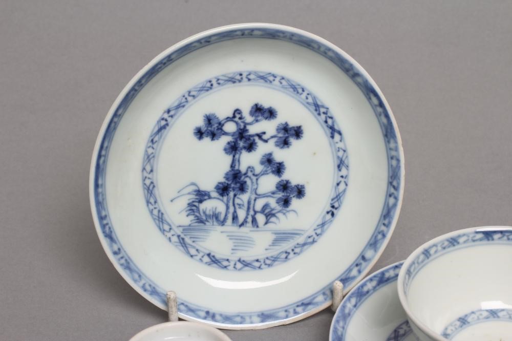 TWO NANKING CARGO PORCELAIN TEA BOWLS AND SAUCERS Image