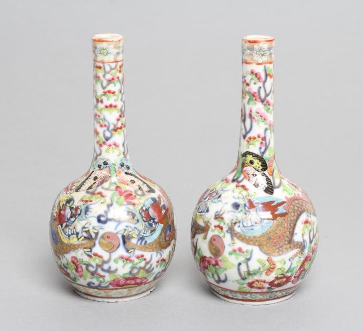 A PAIR OF CHINESE PORCELAIN BOTTLE VASES painted in underglaze blue with a dragon chasing the Image