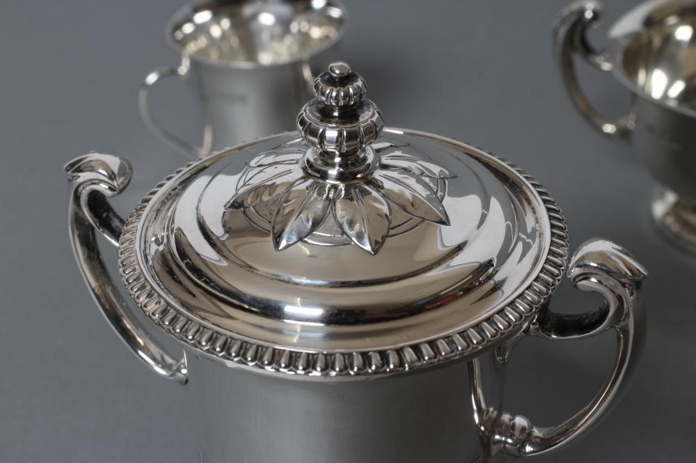 A SMALL TWO HANDLED SILVER TROPHY AND COVER Image
