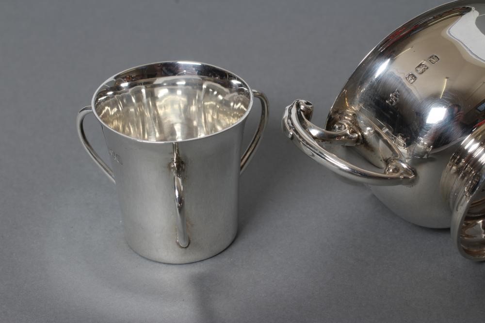 A SMALL TWO HANDLED SILVER TROPHY AND COVER Image