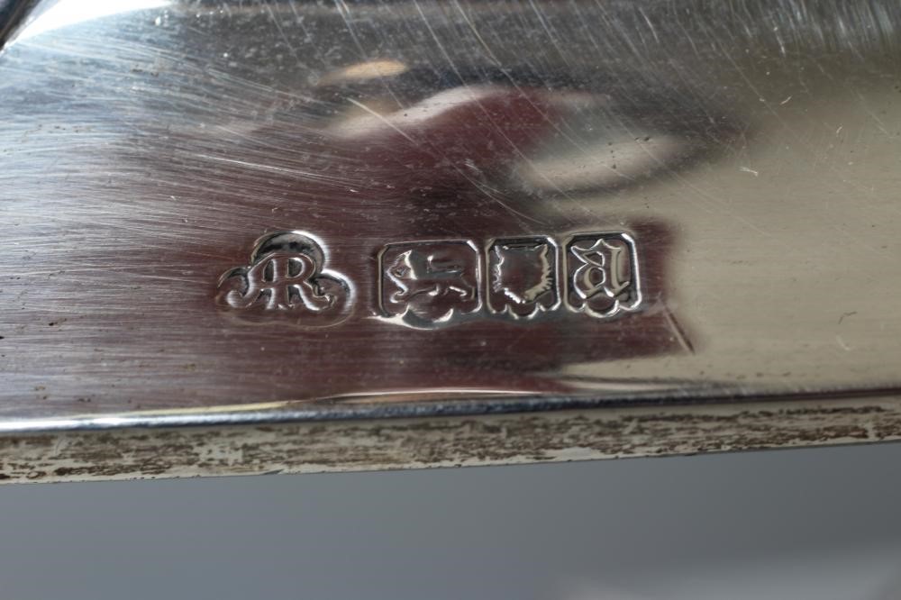 A PAIR OF ARTS AND CRAFTS SILVER CANDLESTICKS Image