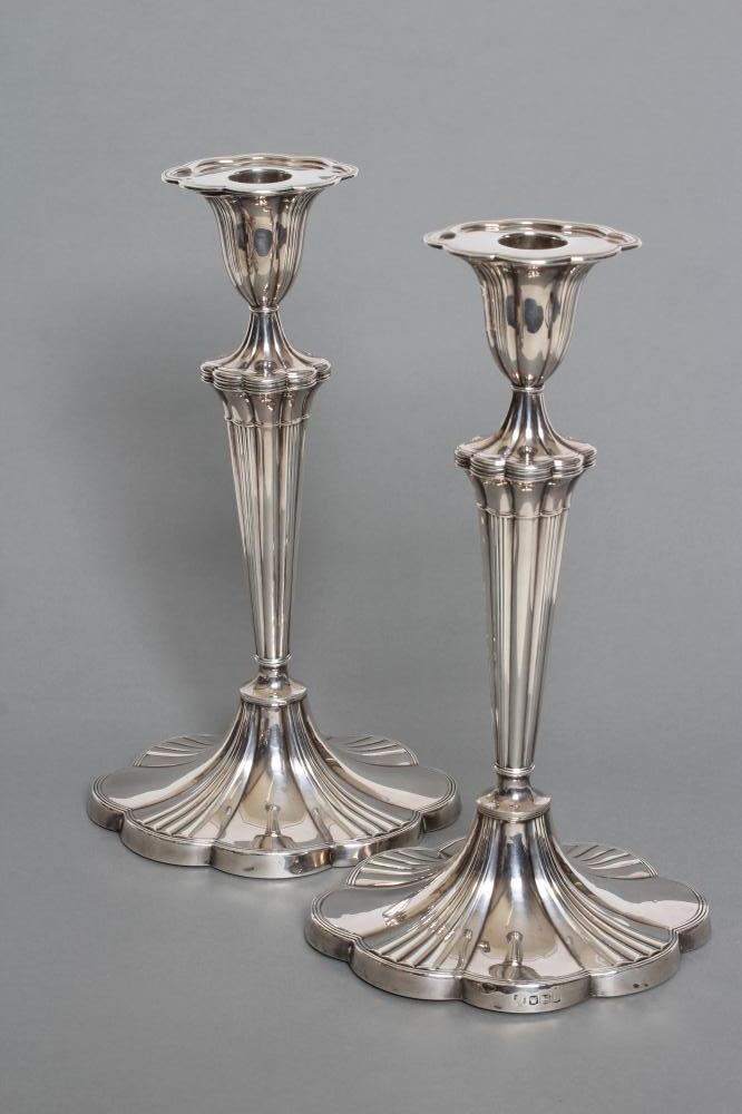 A PAIR OF SILVER CANDLESTICKS Image