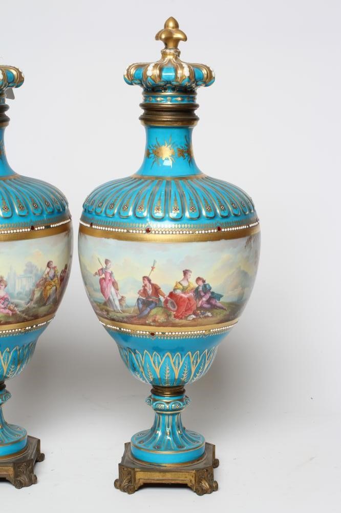 A PAIR OF FRENCH PORCELAIN GARNITURE VASES AND COVERS Image