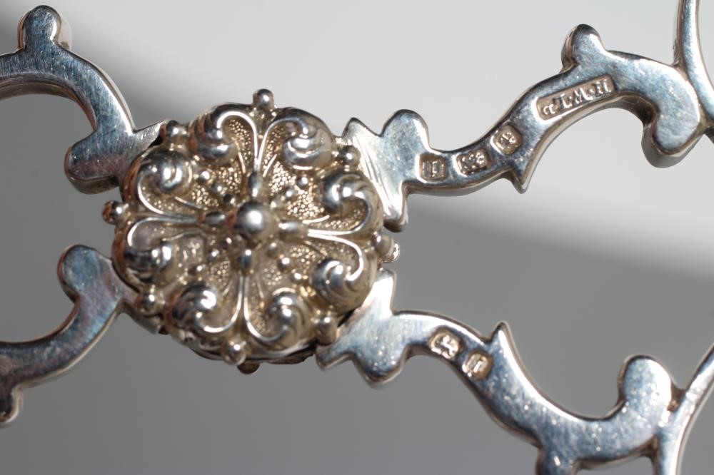 A SET OF FOUR GEORGE II SILVER PICTURE BACK TEASPOONS Image