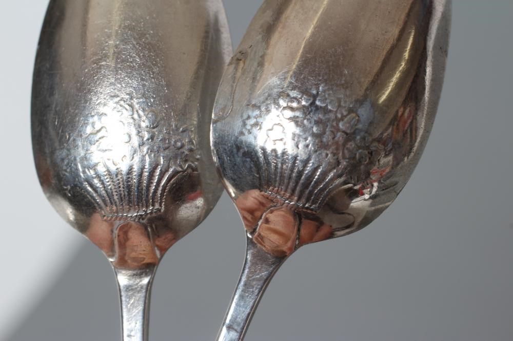 A SET OF FOUR GEORGE II SILVER PICTURE BACK TEASPOONS Image