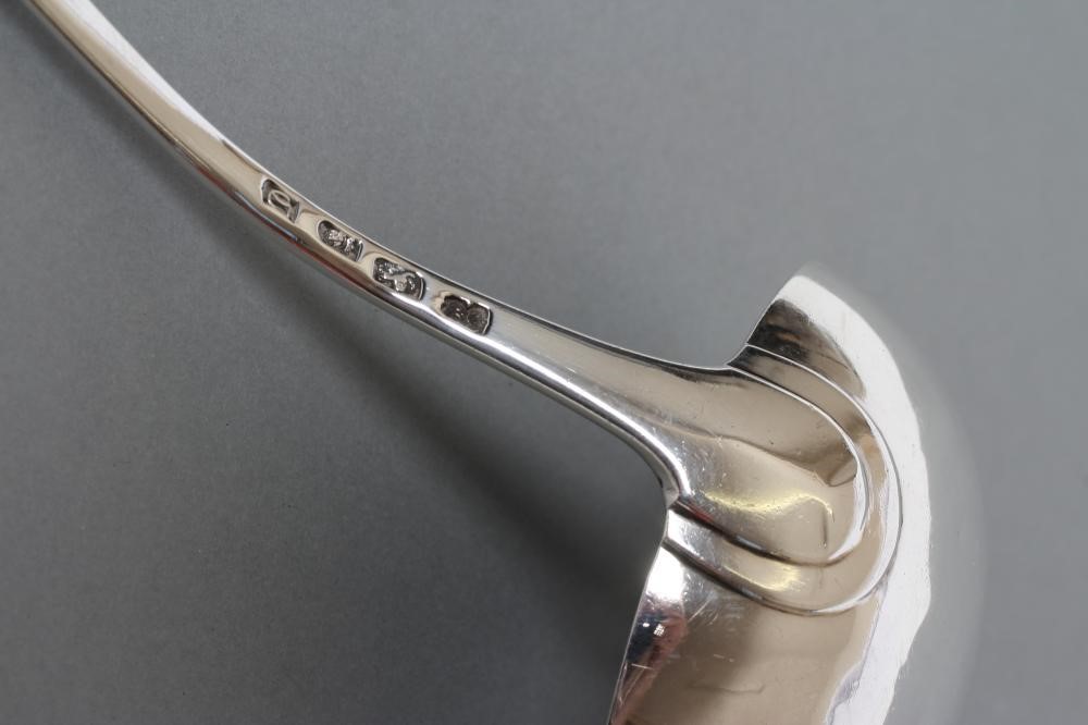 A GEORGE III SILVER SOUP LADLE Image