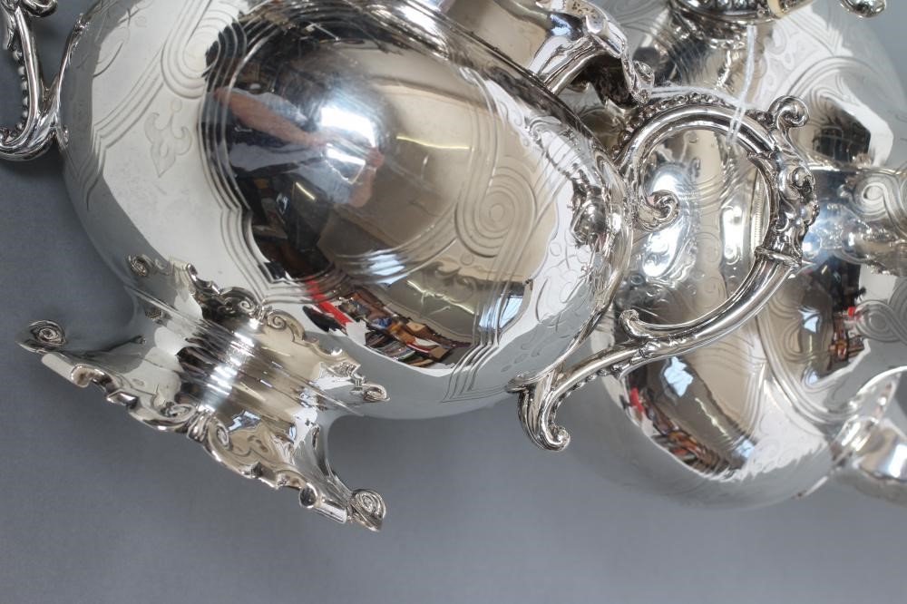 AN EARLY VICTORIAN SILVER FOUR PIECE TEA AND COFFEE SERVICE Image