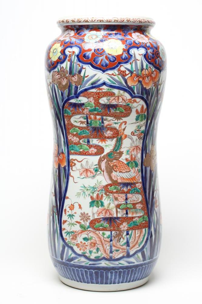 AN IMARI PORCELAIN STICK STAND of slightly waisted cylindrical form painted in typical palette with Image