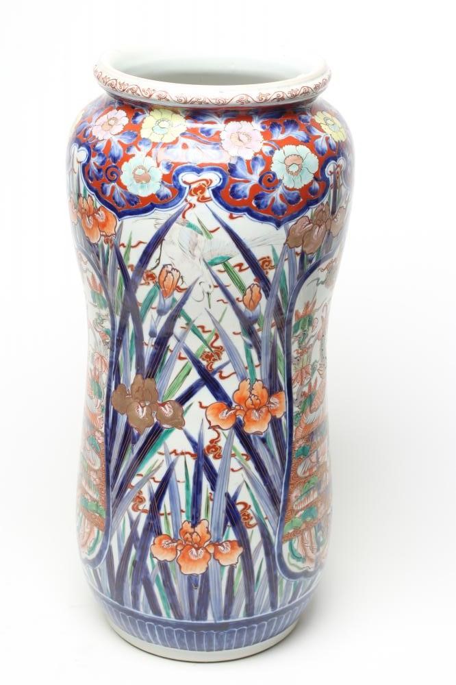 AN IMARI PORCELAIN STICK STAND of slightly waisted cylindrical form painted in typical palette with Image