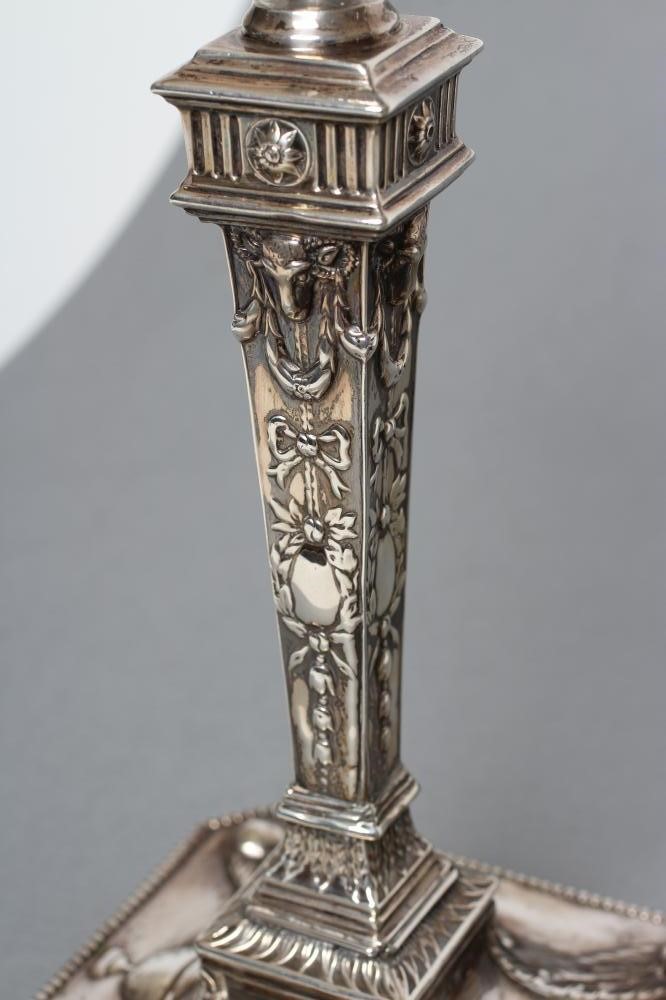 A PAIR OF LATE VICTORIAN NEO CLASSICAL STYLE CANDLESTICKS Image