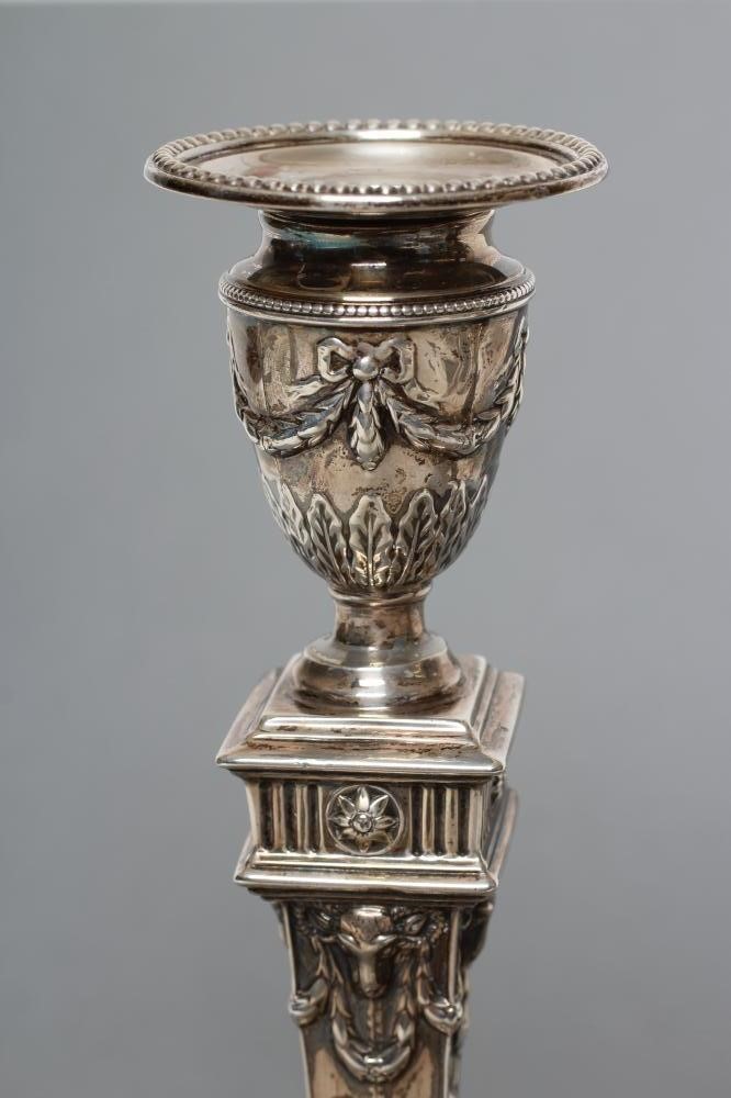 A PAIR OF LATE VICTORIAN NEO CLASSICAL STYLE CANDLESTICKS Image