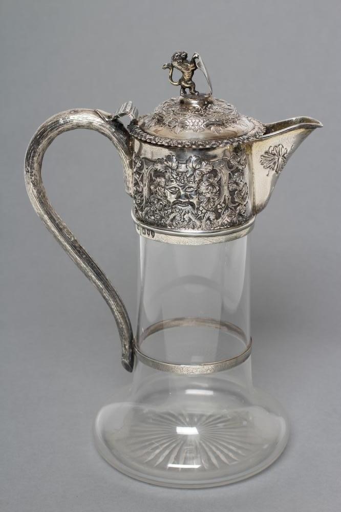 A LATE VICTORIAN GLASS CLARET JUG Image