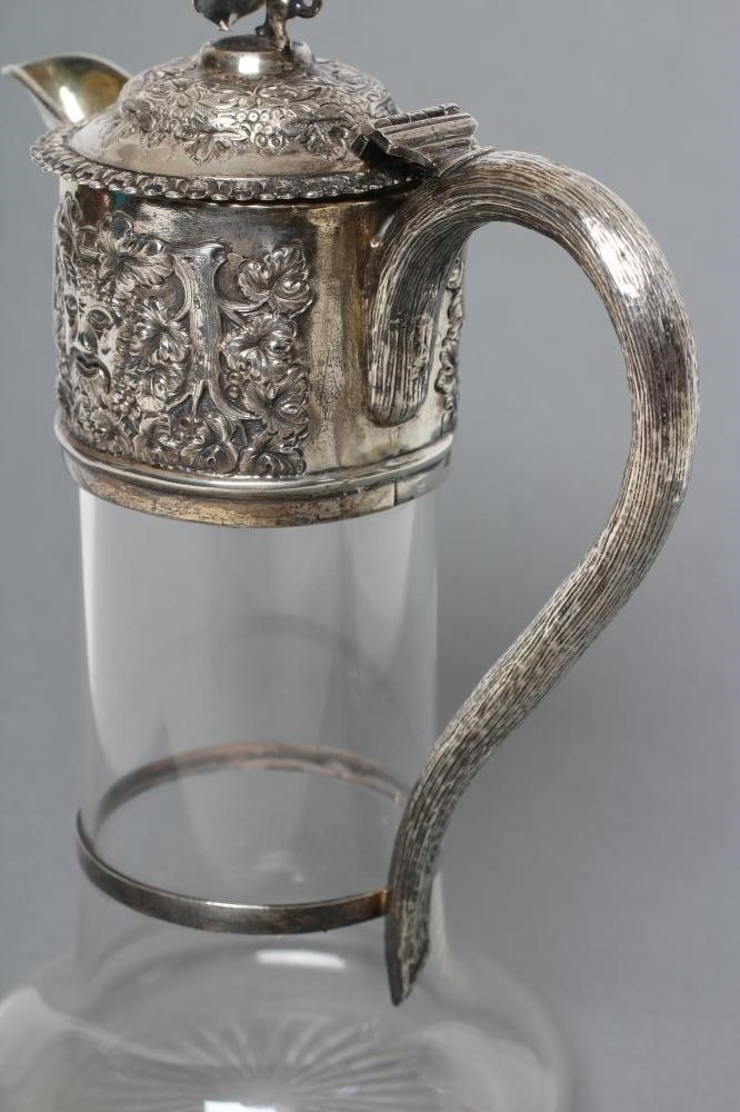 A LATE VICTORIAN GLASS CLARET JUG Image
