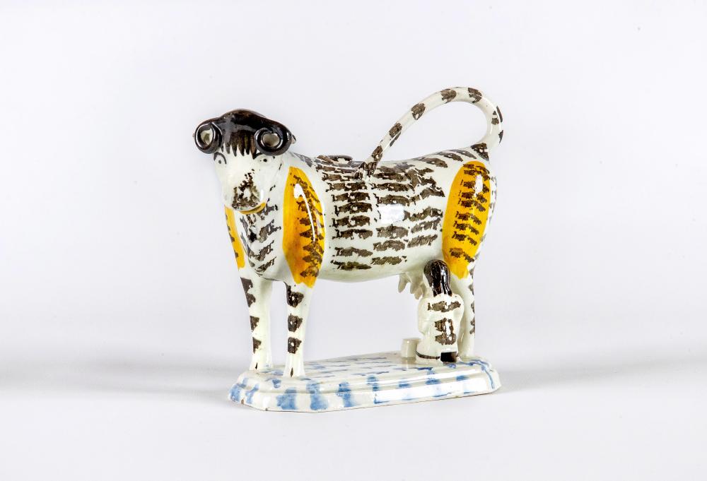 A YORKSHIRE PEARLWARE COW CREAMER AND COVER Image