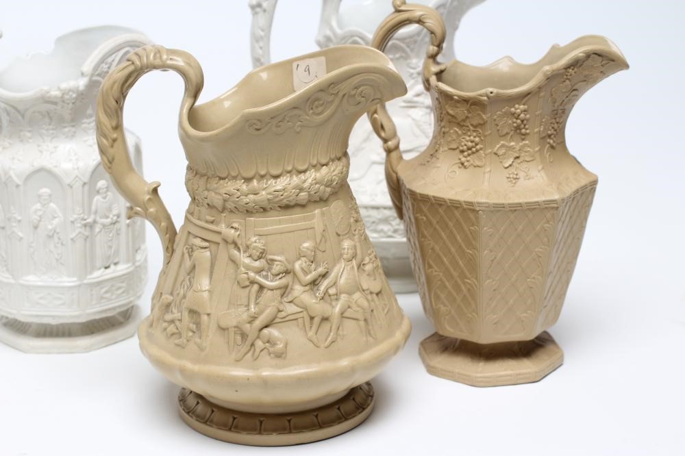 A COLLECTION OF SIX EARLY VICTORIAN SMEAR GLAZED STONEWARE JUGS Image