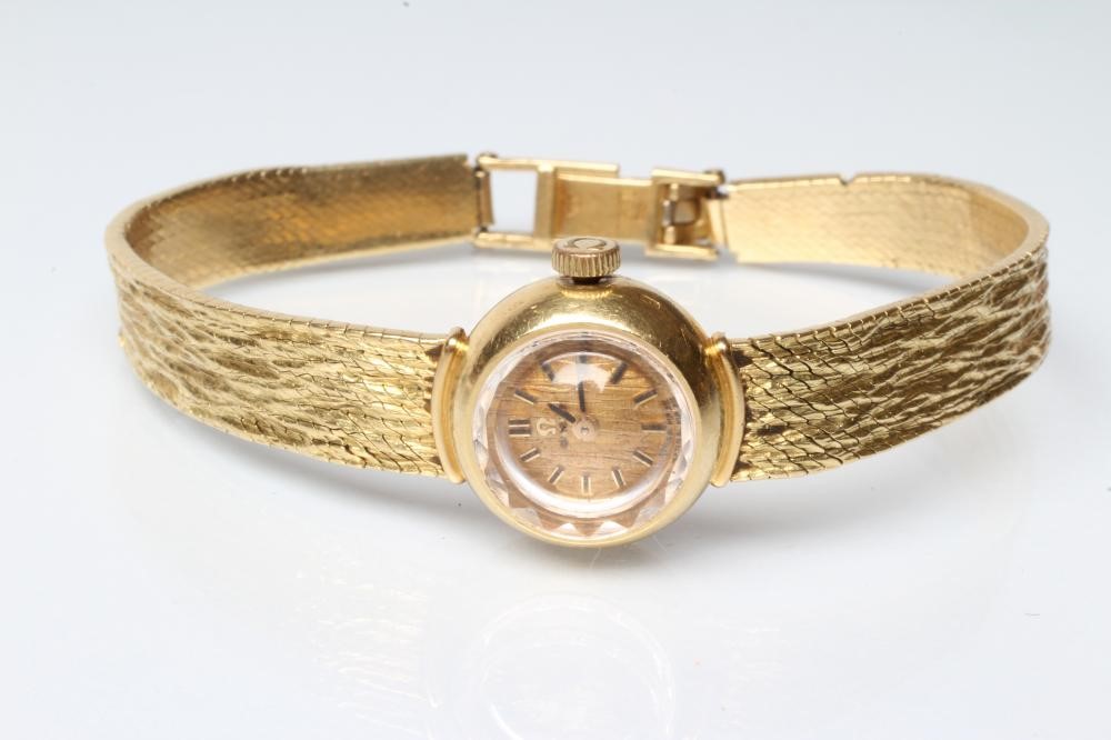 A LADY'S 18CT GOLD OMEGA WRISTWATCH Image