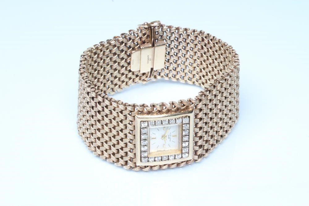 A LADY'S 9CT GOLD AND DIAMOND JAQUET-GIRARD COCKTAIL WATCH Image