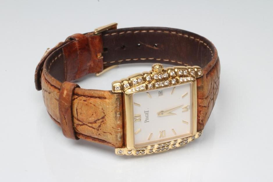 A LADY'S 18CT GOLD AND DIAMOND PIAGET WRISTWATCH Image