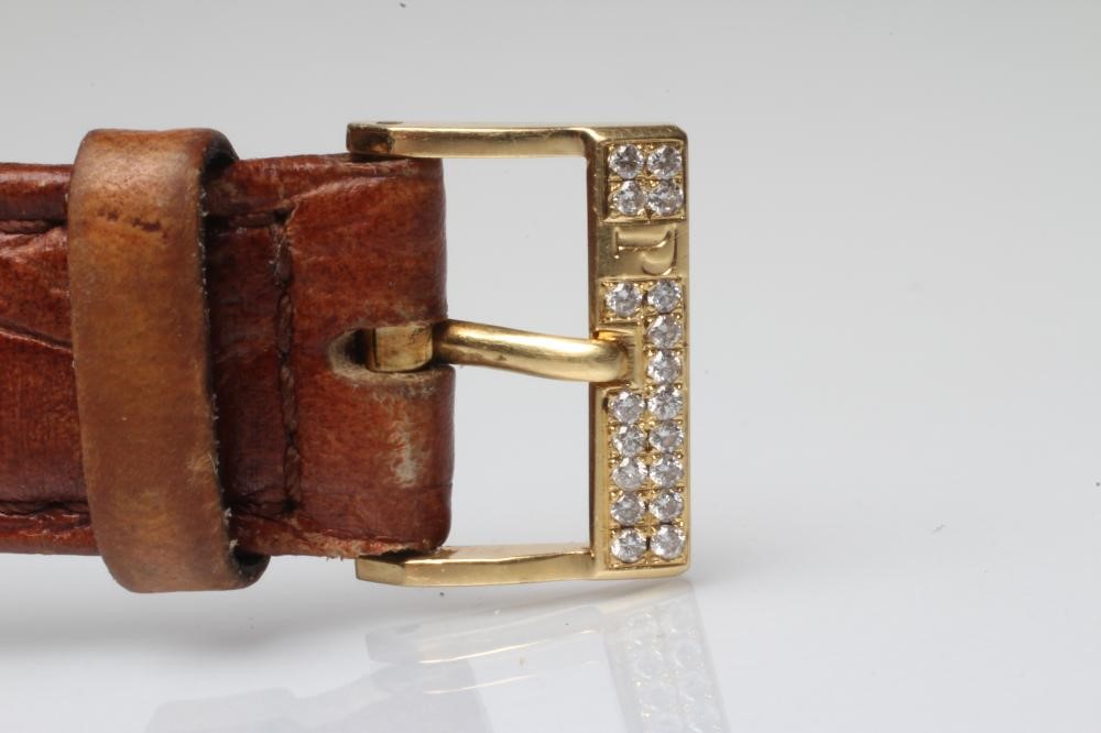 A LADY'S 18CT GOLD AND DIAMOND PIAGET WRISTWATCH Image