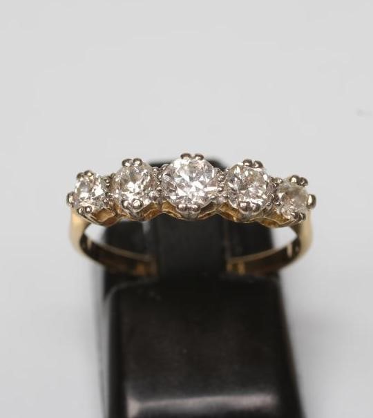 A FIVE STONE DIAMOND RING Image