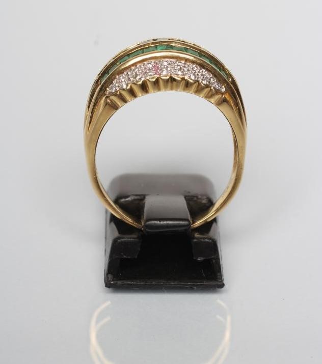 AN EMERALD AND DIAMOND COCKTAIL RING Image