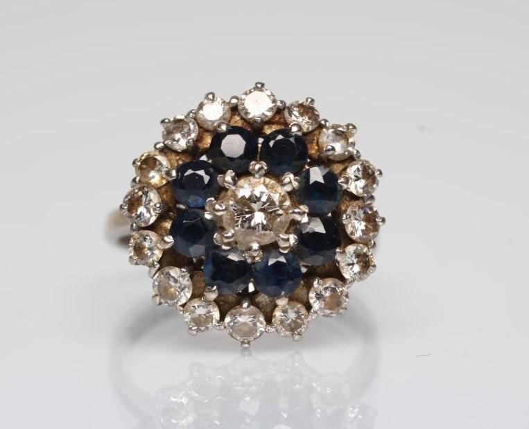 A SAPPHIRE AND DIAMOND CLUSTER RING Image
