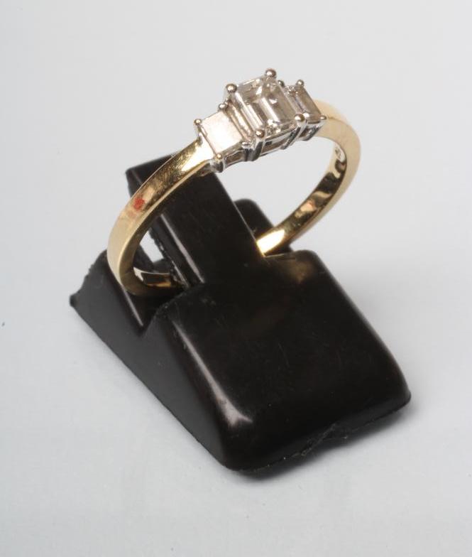 A THREE STONE DIAMOND RING Image