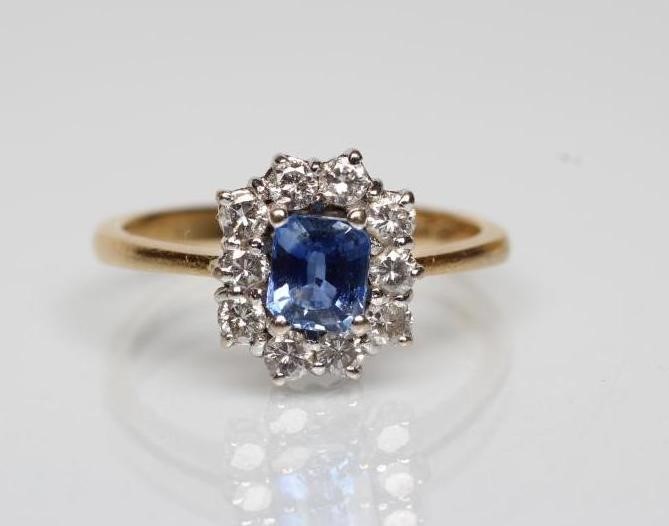 A SAPPHIRE AND DIAMOND CLUSTER RING Image