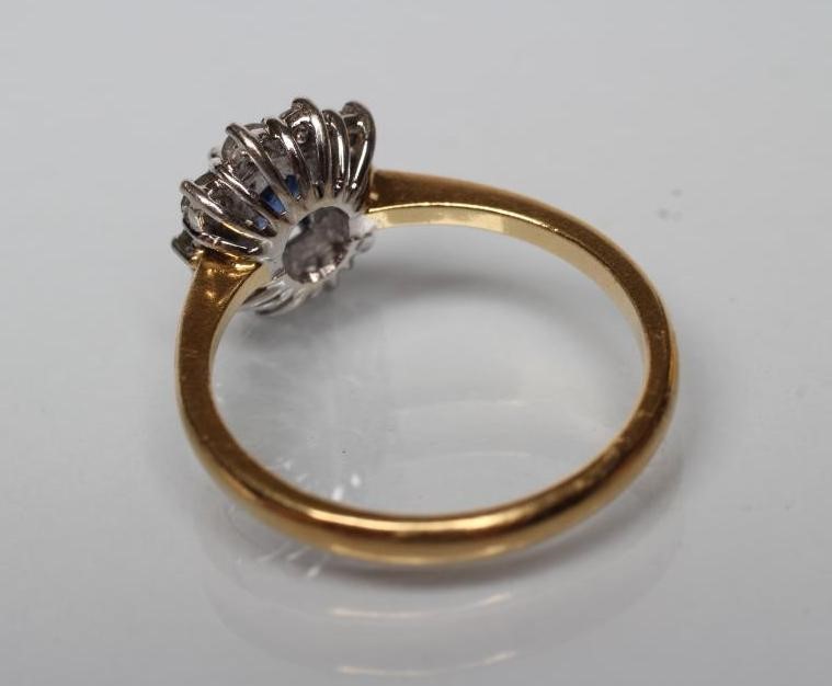 A SAPPHIRE AND DIAMOND CLUSTER RING Image
