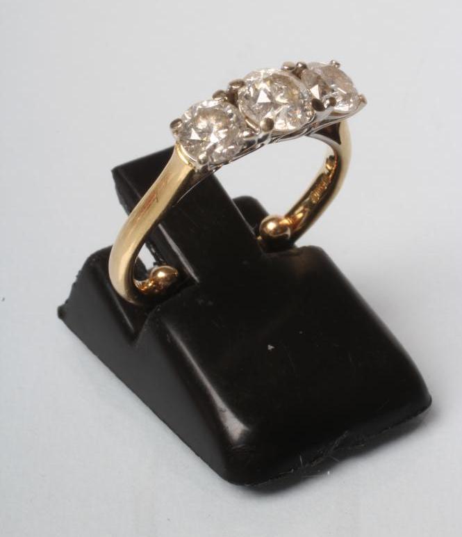 A THREE STONE DIAMOND RING Image