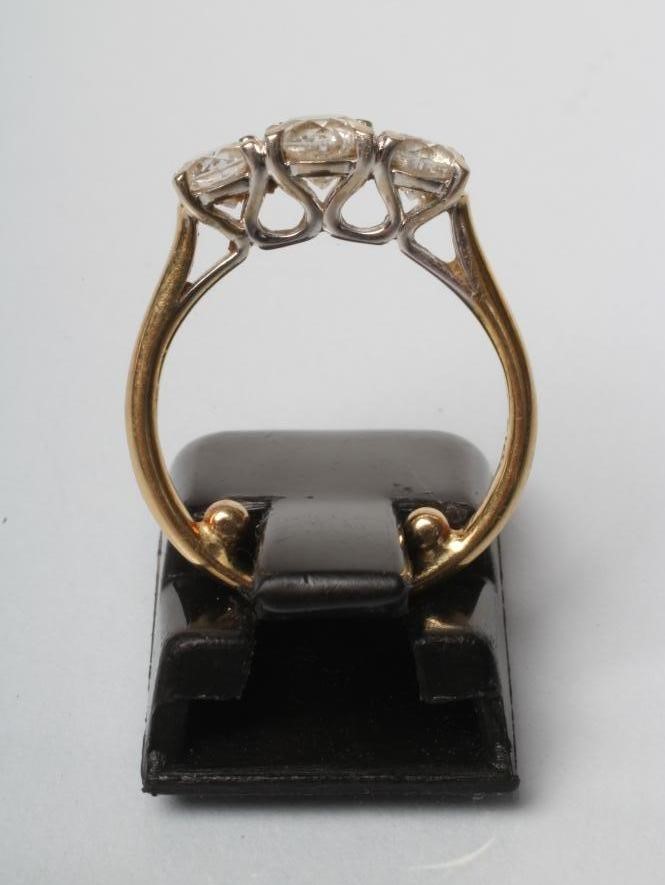 A THREE STONE DIAMOND RING Image