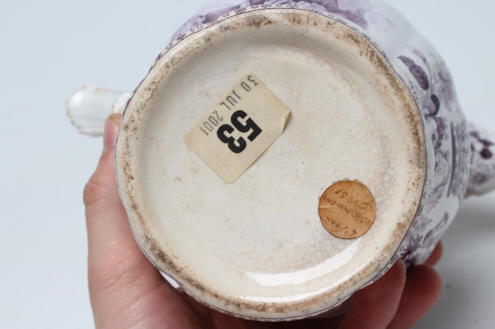 OF ROYAL INTEREST - a pottery jug of lobed baluster form printed in underglaze lilac with a half Image