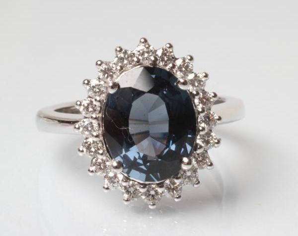 A SAPPHIRE AND DIAMOND CLUSTER RING Image