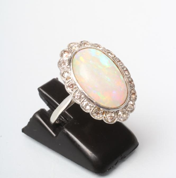 AN OPAL AND DIAMOND CLUSTER DRESS RING Image