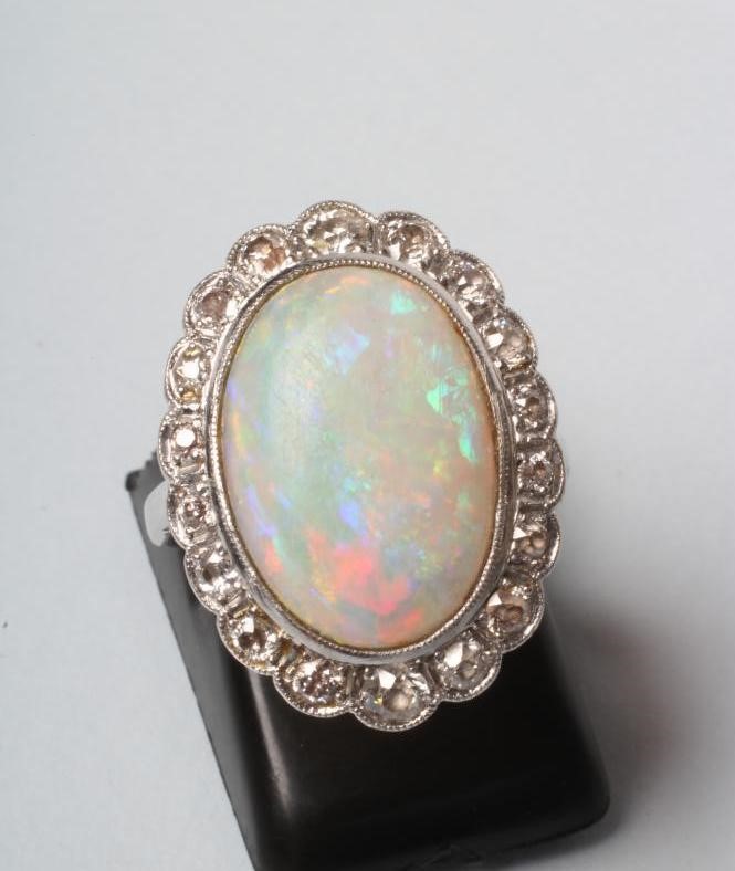 AN OPAL AND DIAMOND CLUSTER DRESS RING Image