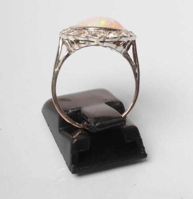 AN OPAL AND DIAMOND CLUSTER DRESS RING Image