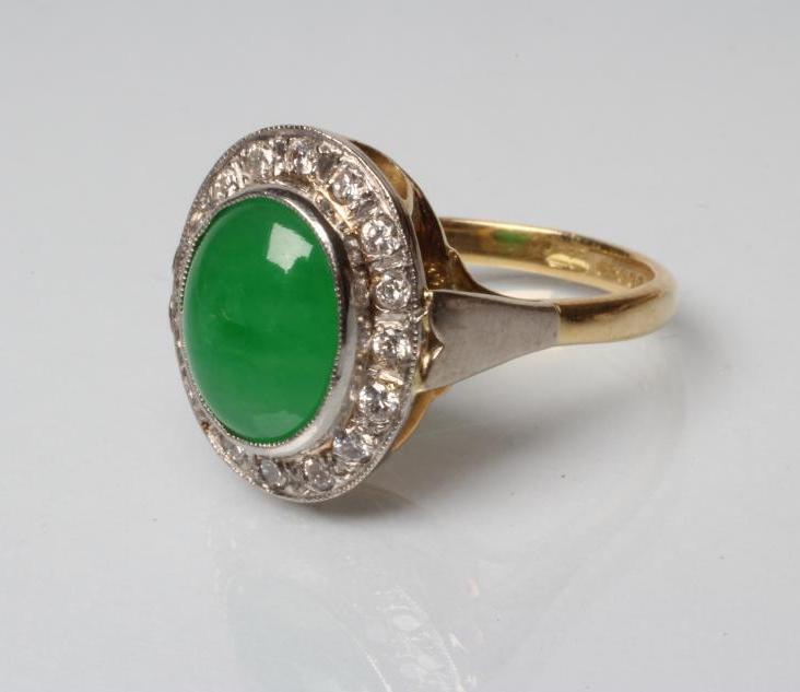 AN EMERALD AND DIAMOND DRESS RING Image