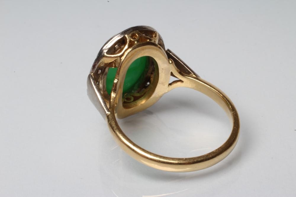 AN EMERALD AND DIAMOND DRESS RING Image