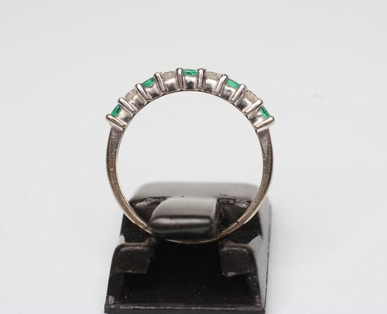AN EMERALD AND DIAMOND HALF HOOP ETERNITY RING Image