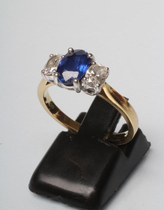 A SAPPHIRE AND DIAMOND THREE STONE RING Image