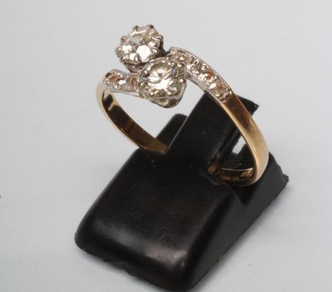 A TWO STONE DIAMOND CROSSOVER RING Image