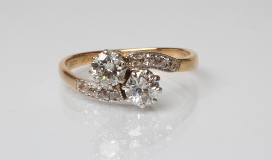 A TWO STONE DIAMOND CROSSOVER RING Image