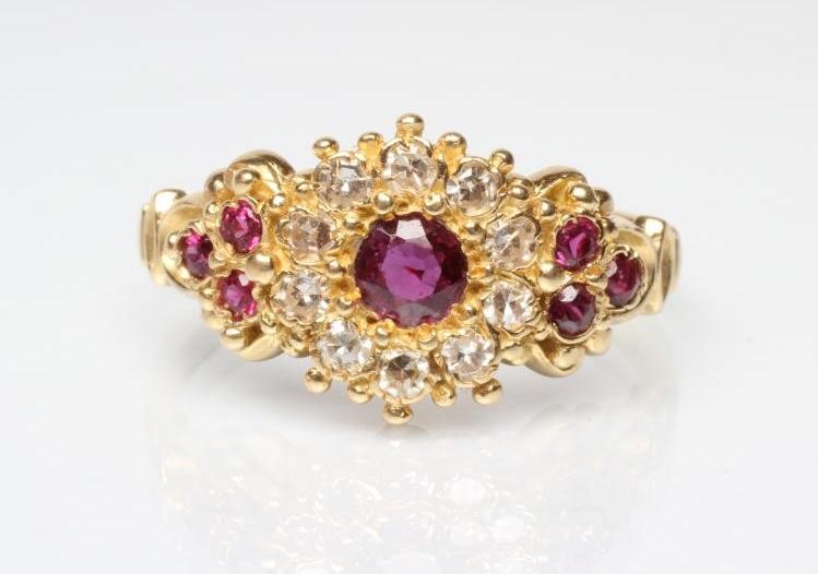 A RUBY AND DIAMOND CLUSTER DRESS RING Image