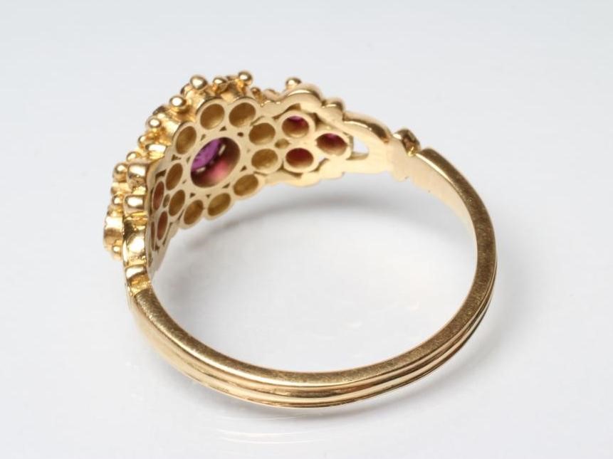 A RUBY AND DIAMOND CLUSTER DRESS RING Image