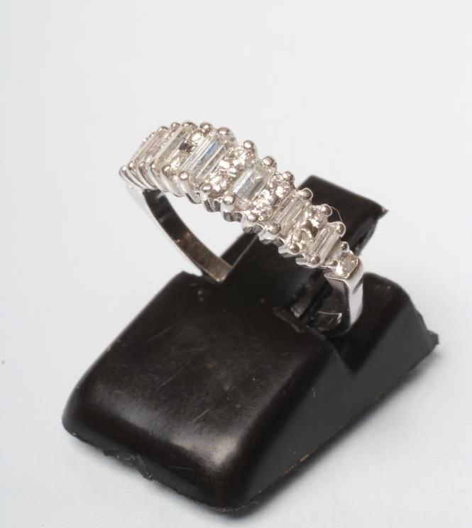 A DIAMOND HALF HOOP RING Image