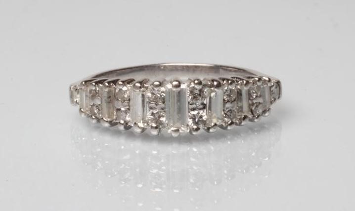 A DIAMOND HALF HOOP RING Image