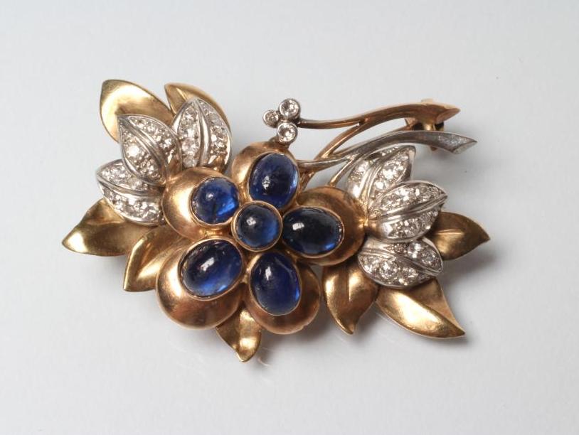 A SAPPHIRE AND DIAMOND FLOWER BROOCH Image