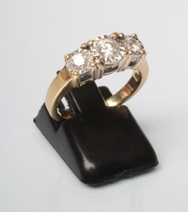 A THREE STONE DIAMOND RING Image