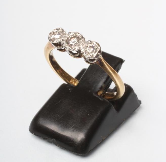 A THREE STONE DIAMOND RING Image